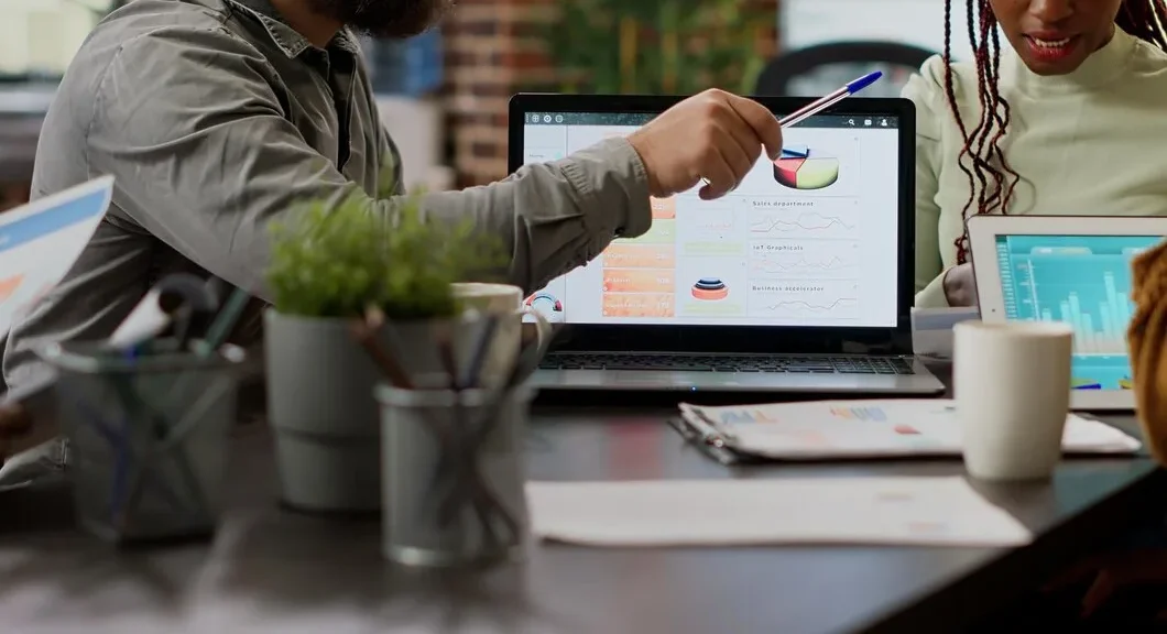 diverse-team-coworkers-analyzing-business-charts